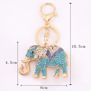 Elephant rhinestone keychain in gold metal with blue crystals, dimensions 6cm x 4.5cm