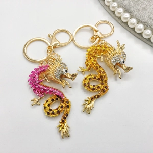 Exquisite Chinese dragon keychains with colorful crystals and gold-plated metal base