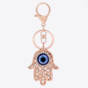 Roségoldener Hamsa Hand Schlüsselanhänger mit blauem Auge und funkelnden Kristallen