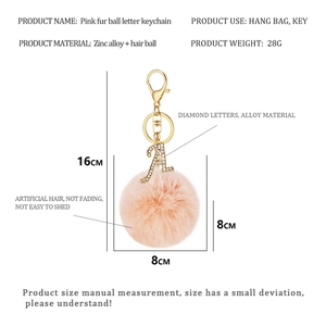 Detail showing dimensions of pink faux fur keychain with rhinestone letter A and gold clasp