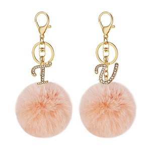 Pink faux fur pompom keychain with crystal letter T and U charms in gold metal finish