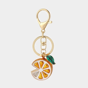 Sparkling rhinestone orange fruit keychain with golden lobster clasp and green leaf detail