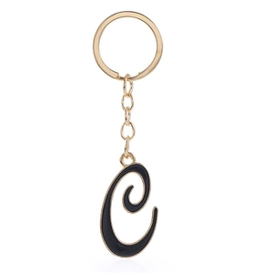 Detail view of letter C keychain with gold metal base and black enamel finish