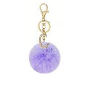 Close-up of a purple faux fur ball keychain with a gold rhinestone-encrusted letter C charm