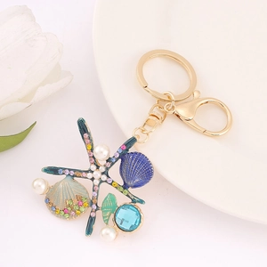 Porte-clés en Alliage Étoile de Mer Scintillant Strass Künstliche Perle d'Imitation Coquille Pendentif Bijoux de Mode pour Sac Femme Cadeau