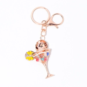 Creative rose gold cocktail glass keychain with colorful crystals and yellow flower