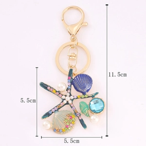 Porte-clés étoile de mer et coquillage coloré avec strass et détails de perles