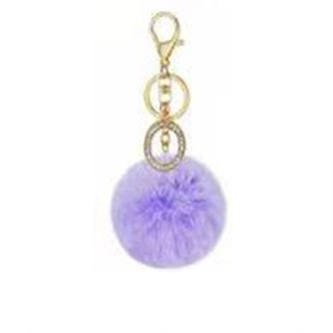 Detail of light purple faux rabbit fur keychain with gold lobster clasp and rhinestones