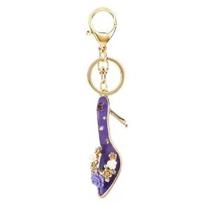 Detailed view of purple high heel keychain with floral enamel and sparkling rhinestones