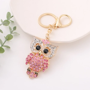 Close-up of owl keychain with pink and white rhinestones and gold-tone lobster clasp