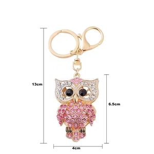Detail view of pink owl keychain with rhinestone inlay showing 13cm full length measurements