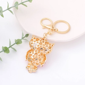 Exquisite gold hollow owl keychain with heart patterns and lobster clasp for bags