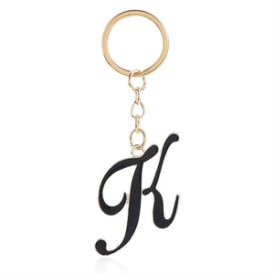 Letter K keychain in black enamel and gold finish, luxury font for personal accessory