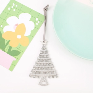 Silver Christmas tree ornament with rhinestones and grey hanging string on white background