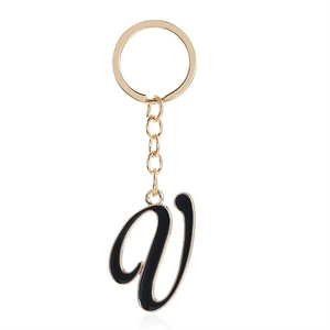 Letter V keychain in gold metal and black enamel with circular ring and chain