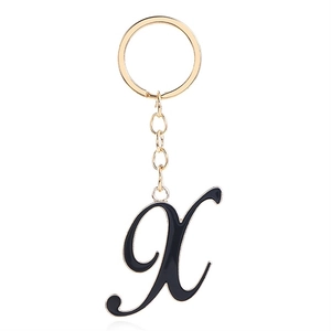 Letter X keychain with black enamel finish and gold metal frame on a round ring