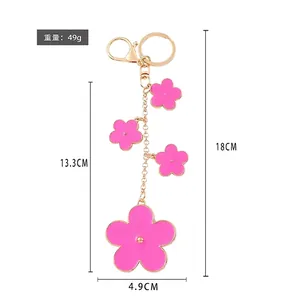 Pink enamel five-leaf clover keychain with gold alloy finish and 18CM total length
