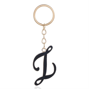 Letter L keychain in black enamel and gold finish with metallic ring and chain link