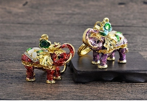 Exquisite elephant pendant with colorful enamel flowers and sparkling gemstones