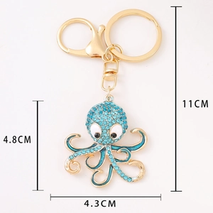 Golden octopus keychain with sparkling light blue rhinestones and lobster clasp hooks