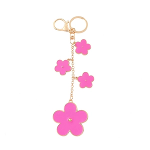 Pink and gold clover flower keychain with enamel petals and golden lobster clasp
