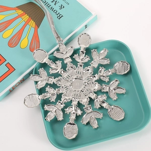 Silver snowflake ornament made of zinc alloy with crystals and grey velvet ribbon hanger