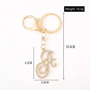 Sparkling gold letter A keychain with rhinestones and lobster clasp on white background