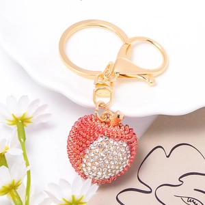 Exquisite lychee fruit keychain with red rhinestones on a gold alloy base and lobster clasp