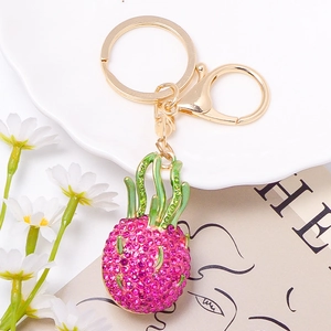 Sparkling pink rhinestone dragon fruit keychain with gold alloy clasp and green leaves