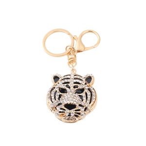 Golden leopard head keychain with sparkling rhinestones and black enamel details