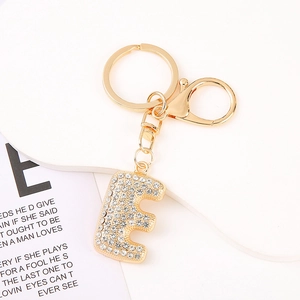 Detail of gold letter E keychain with sparkling white rhinestones and sturdy lobster clasp