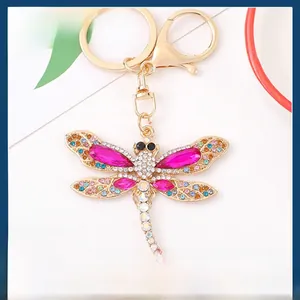 Macro shot of dragonfly keychain featuring colorful crystals and gold-plated alloy details