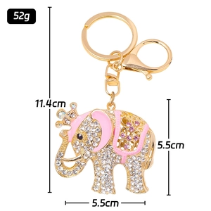 Sparkling elephant keychain with pink enamel and crown detailing, measured 11.4cm