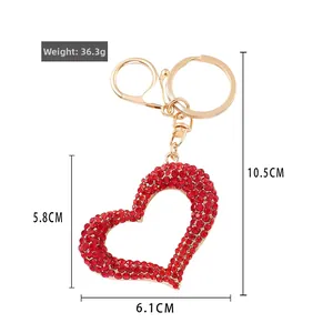 Red rhinestone heart keychain in gold alloy with dimensions and 36.3g weight detail