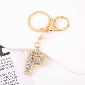 Detailed view of a gold-plated letter P keychain fully encrusted with sparkling crystals