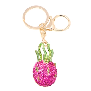 Macro view of crystal dragon fruit keychain with pink rhinestones and gold lobster clasp
