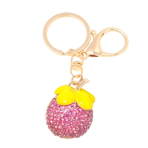 Detail of purple rhinestone mangosteen keychain with golden zinc alloy clasp