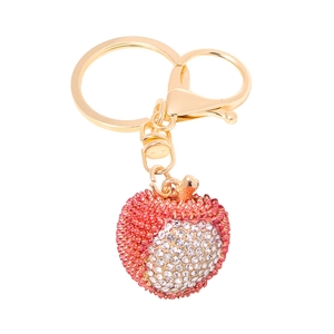 Detail of strawberry fruit keychain with sparkling red rhinestones and gold lobster clasp