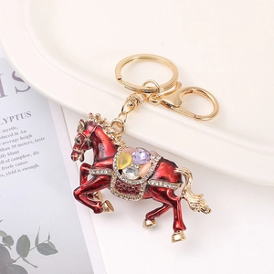 Sparkling red enamel horse keychain with colorful rhinestones on a golden ring