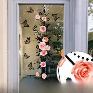Detail of double-sided pink rose and butterfly window stickers with adhesive backing