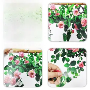 Detail of waterproof window sticker showing pink rose design and transparent texture