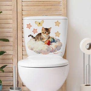 Detailed view of a watercolor cat and clouds sticker applied on a white toilet tank