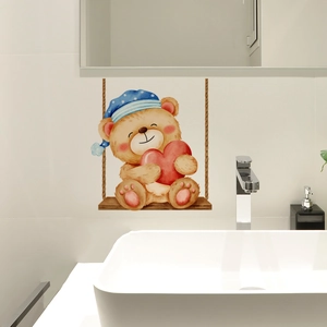Detail of watercolor cartoon bear on swing wall sticker applied to white bathroom tile