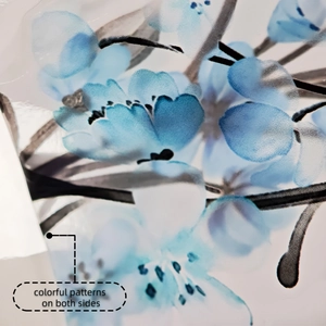 Close-up of double-sided watercolor flower static cling window decal with blue petals