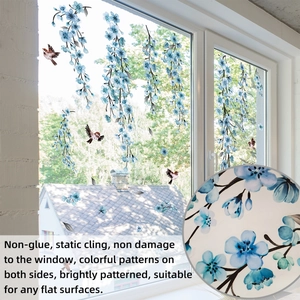 Detail of static cling window film with blue floral branches and bird pattern