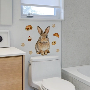 Luminous cartoon rabbit and food stickers applied on a minimalist bathroom wall decoration