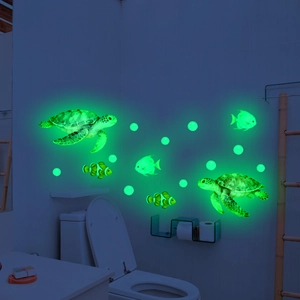 Luminous marine life wall decals featuring sea turtles and clownfish in glowing green light