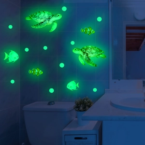Glow in the dark ocean wall stickers featuring sea turtles and fish in a bathroom setting