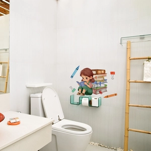 Close-up of a cartoon girl reading theme wall sticker on white tiles in a tidy bathroom