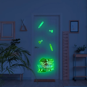 Glow in the dark wall sticker featuring a cartoon girl reading on books with neon green light